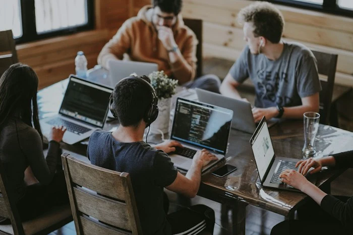 People sharing ideas around a table