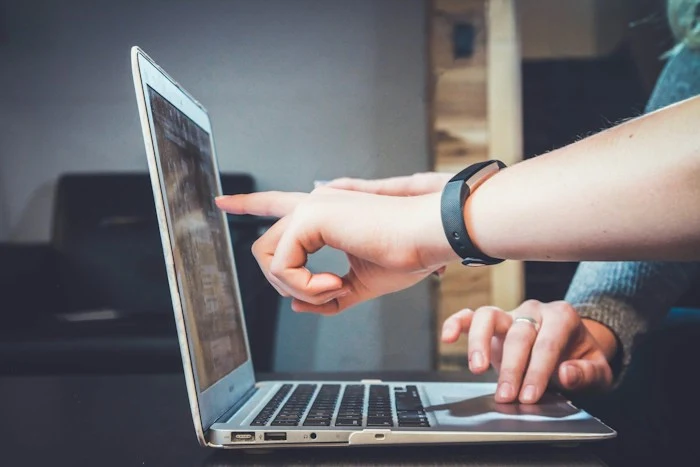 A person using their laptop for an online group activity